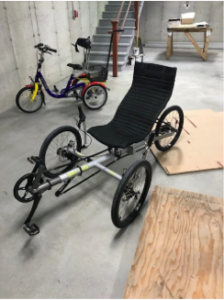 Photograph of recumbent adaptive bicycle.