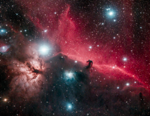 Space image with stars in foreground, Horsehead shadow.