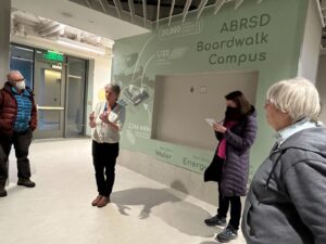 School District Energy Manager Kate Crosby leads visitors on a tour of the Boardwalk School.