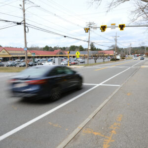 Car in motion heading towards the new Pedestrian Traffic Light