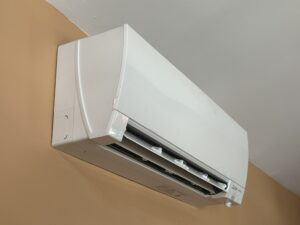 HVAC mini-split unit mounted high on wall